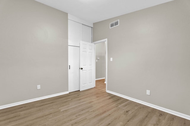 unfurnished room with light hardwood / wood-style flooring