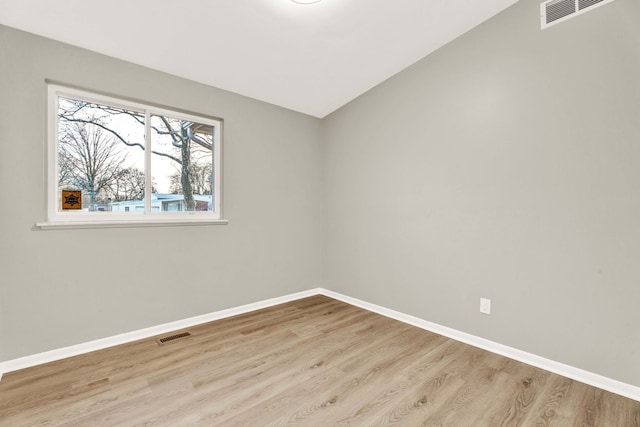 spare room with light wood-type flooring