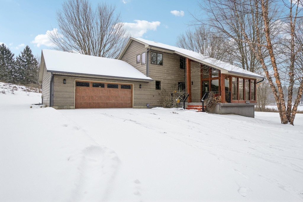 view of front of house with a porch and a garage