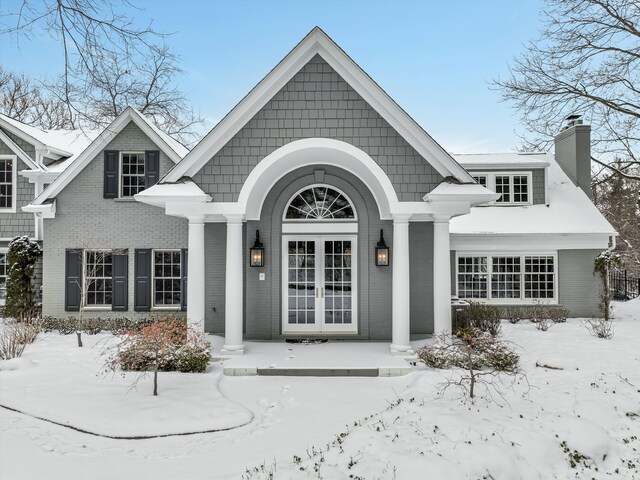 view of snow covered property entrance