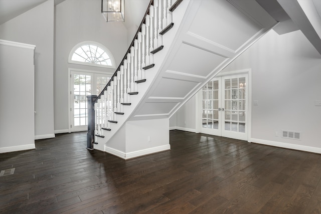 31265 Woodside Dr, Franklin, MI 48025 - unfurnished living room with french doors, stairs, baseboards, visible vents, and dark wood-style floors