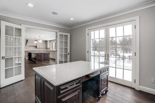 31265 Woodside Dr, Franklin, MI 48025 - kitchen featuring french doors, dark wood-type flooring, crown molding, and a kitchen island