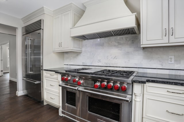 31265 Woodside Dr, Franklin, MI 48025 - kitchen with white cabinets, custom exhaust hood, dark wood-style floors, and high quality appliances