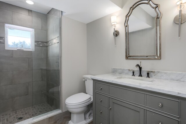 31265 Woodside Dr, Franklin, MI 48025 - bathroom featuring vanity, a tile shower, and toilet