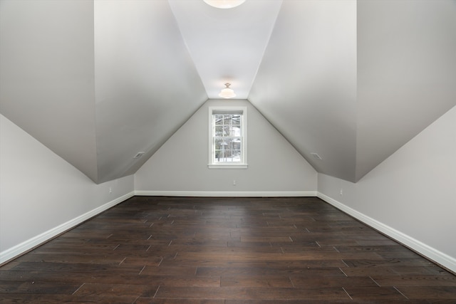 31265 Woodside Dr, Franklin, MI 48025 - additional living space featuring baseboards, dark wood finished floors, and lofted ceiling