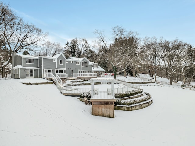 31265 Woodside Dr, Franklin, MI 48025 - snow covered back of property featuring a deck