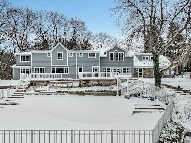 31265 Woodside Dr, Franklin, MI 48025 - snow covered property featuring fence and a wooden deck