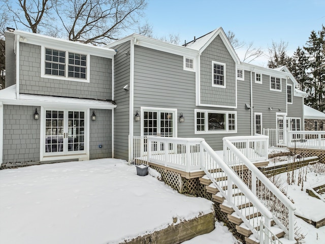 31265 Woodside Dr, Franklin, MI 48025 - snow covered property featuring a wooden deck and stairs