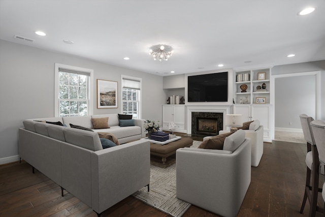 31265 Woodside Dr, Franklin, MI 48025 - living area with recessed lighting, visible vents, dark wood-type flooring, and a fireplace