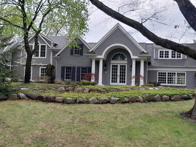 31265 Woodside Dr, Franklin, MI 48025 - craftsman inspired home with french doors, a shingled roof, and a front yard