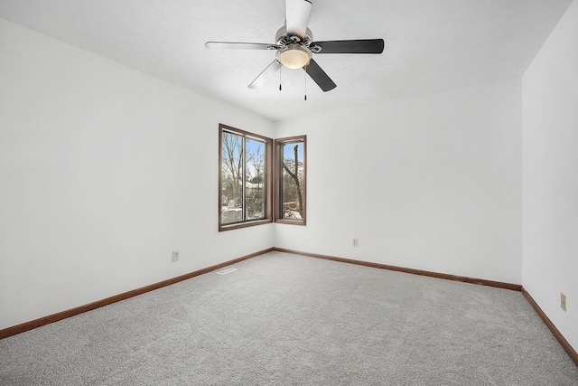 spare room with carpet flooring and ceiling fan