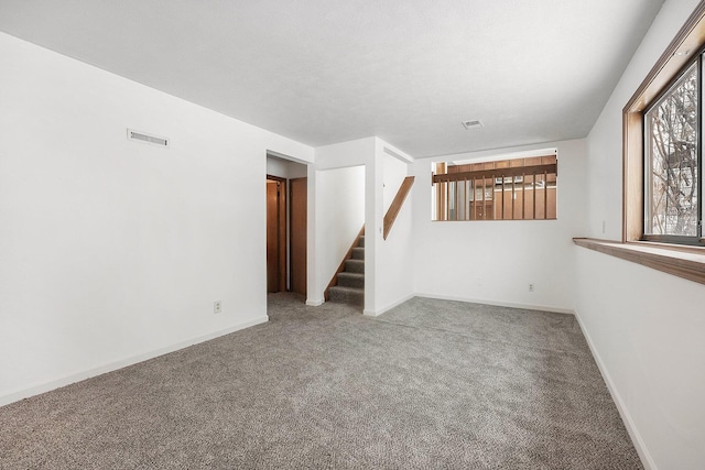 empty room featuring carpet flooring