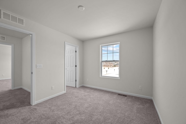 view of carpeted spare room