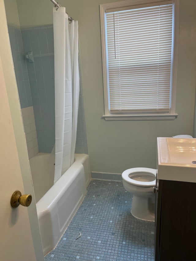 full bathroom featuring tile patterned floors, toilet, shower / tub combo, and vanity