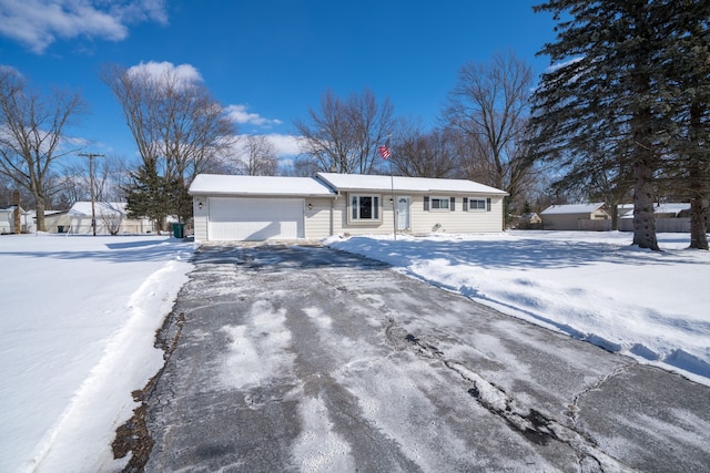 view of front of house featuring an attached garage and driveway