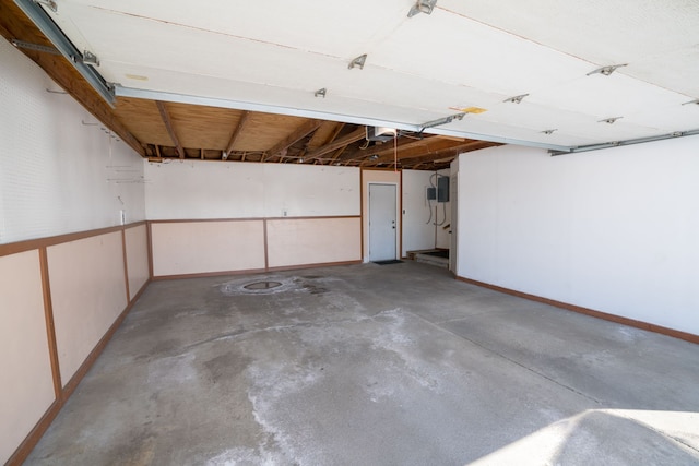 garage featuring baseboards and a garage door opener