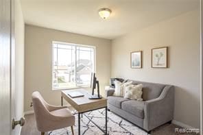 living room featuring baseboards