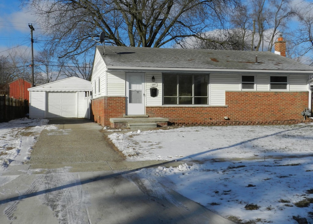 view of front of home with an outbuilding and a garage