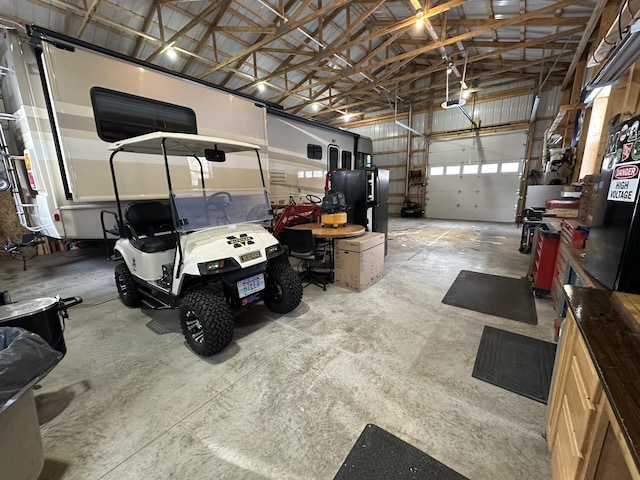 garage featuring black fridge