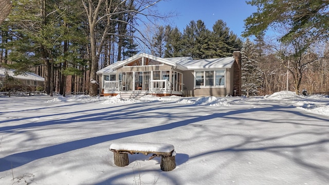 view of front of house with a sunroom