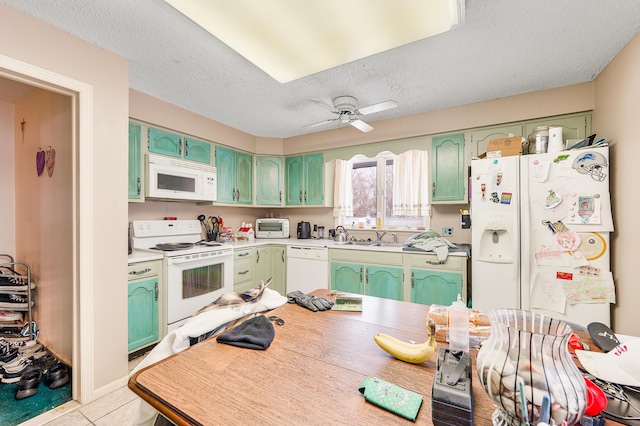 kitchen featuring ceiling fan, white appliances, a textured ceiling, and green cabinetry