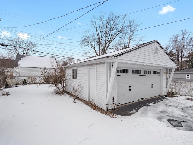 view of snow covered garage