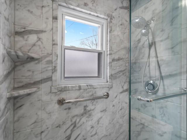 bathroom featuring an enclosed shower