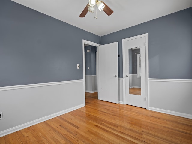 spare room featuring ceiling fan and light hardwood / wood-style flooring