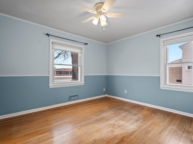 unfurnished room featuring ceiling fan, ornamental molding, and light hardwood / wood-style floors