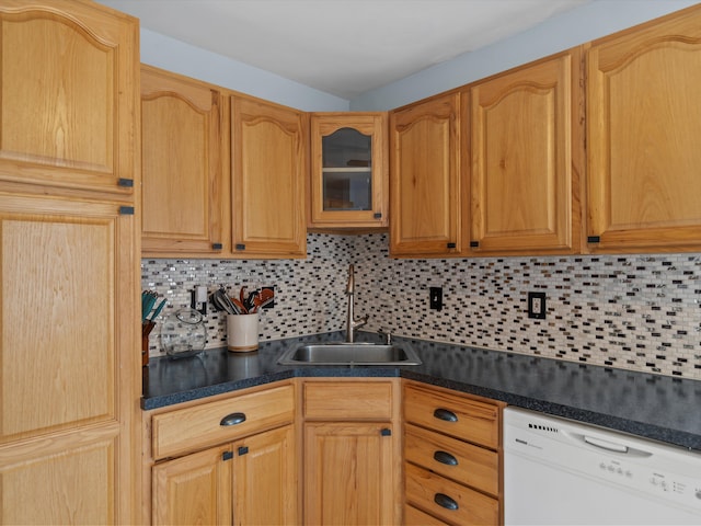 kitchen with sink, backsplash, and white dishwasher