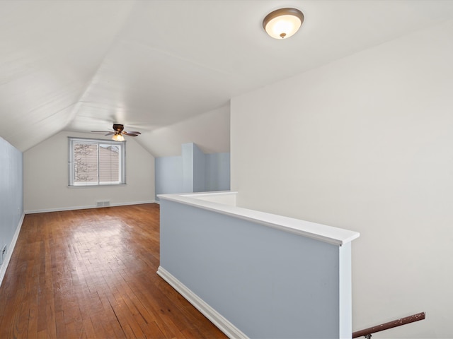 bonus room featuring dark wood-type flooring and lofted ceiling