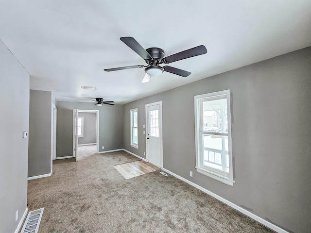 view of carpeted foyer entrance