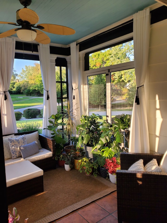 sunroom / solarium with ceiling fan