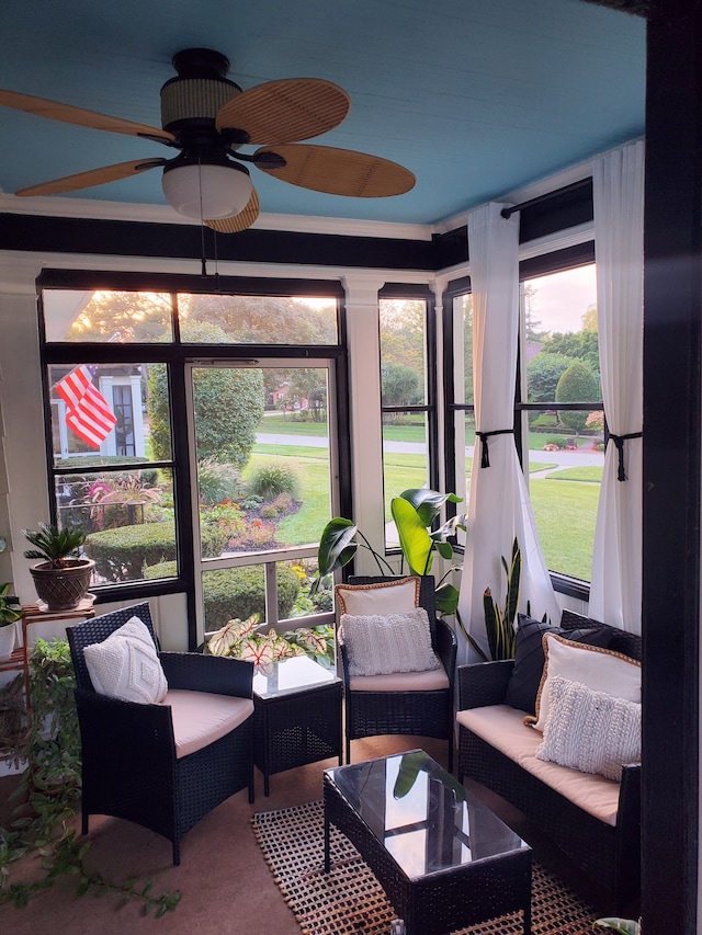 sunroom / solarium with ceiling fan