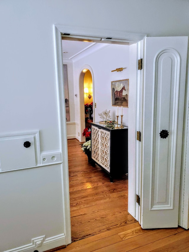 hall with hardwood / wood-style floors