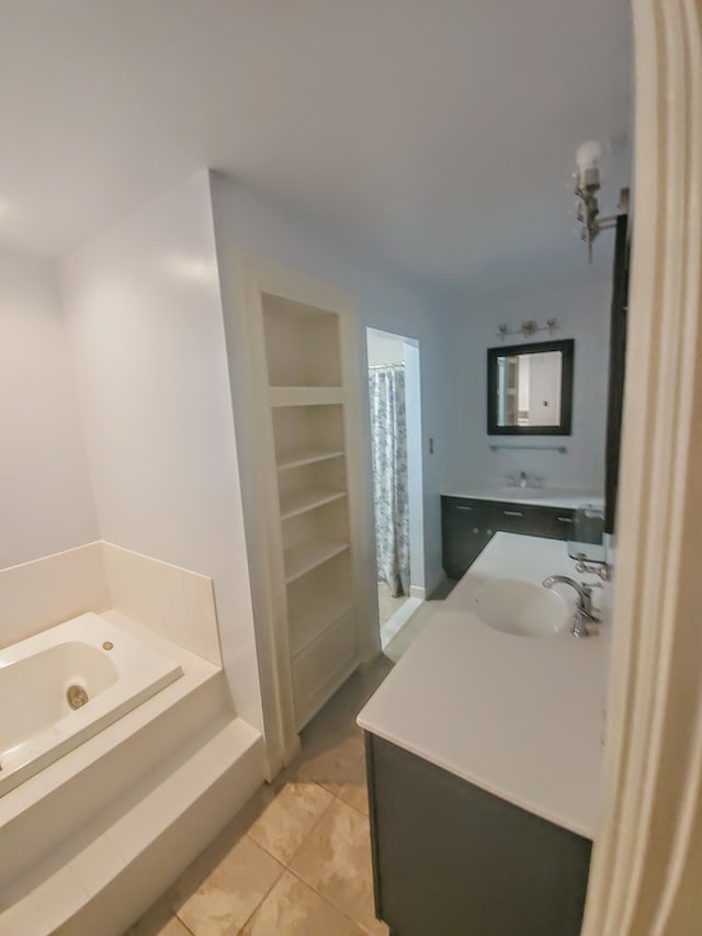 bathroom featuring tile patterned flooring and sink