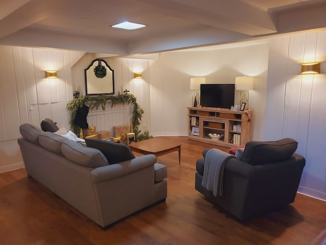 living room with beam ceiling and hardwood / wood-style floors