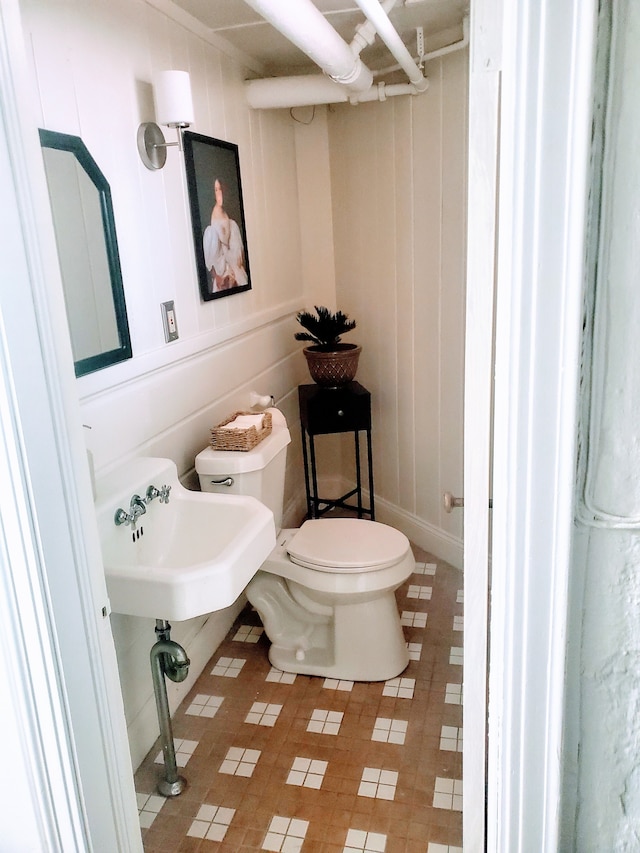 bathroom featuring tile patterned floors and toilet