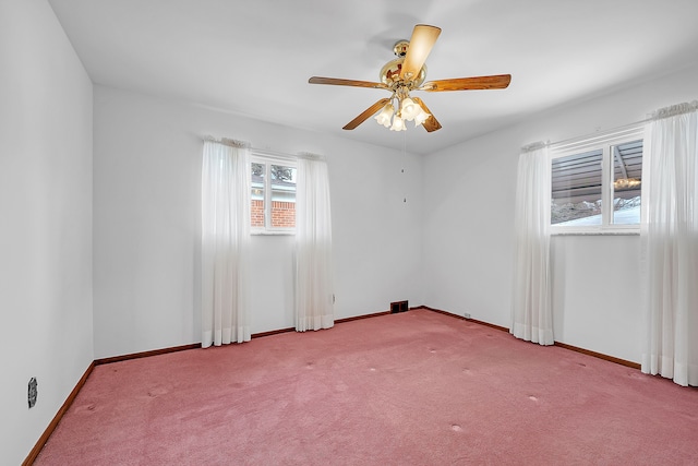 carpeted empty room with ceiling fan