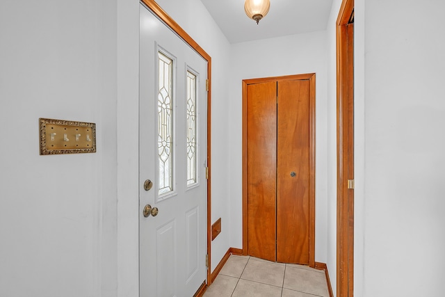 doorway to outside with a healthy amount of sunlight and light tile patterned floors