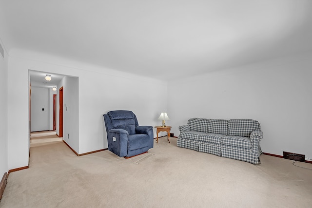 living area with light colored carpet