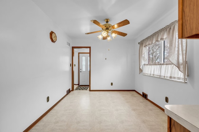 spare room with ceiling fan