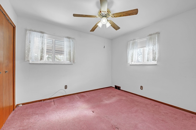 carpeted empty room with ceiling fan