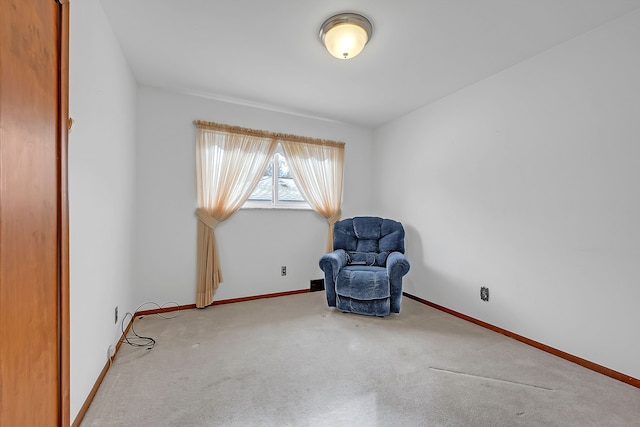 unfurnished room with light colored carpet