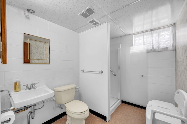 bathroom with walk in shower, toilet, and sink