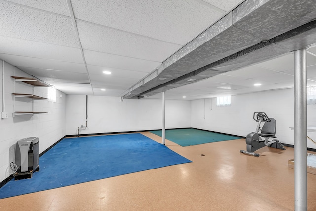 workout room with a paneled ceiling