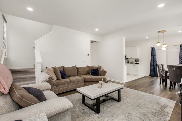 living room with dark hardwood / wood-style flooring