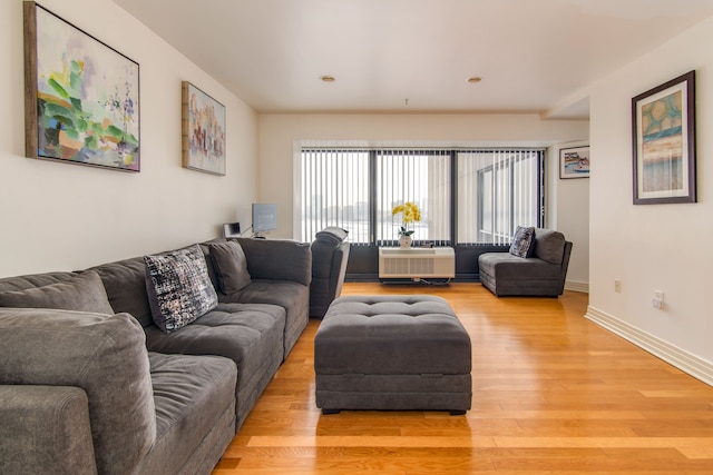 living room with light wood finished floors and baseboards