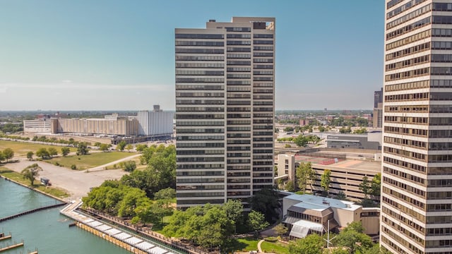 view of property with a water view and a view of city