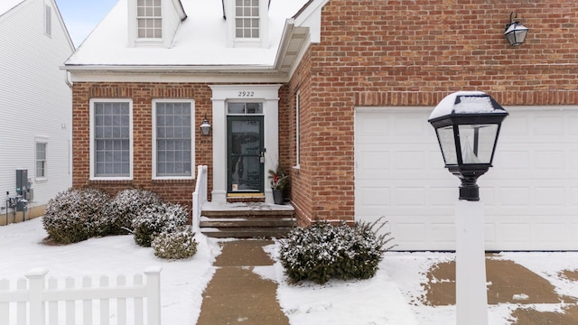 view of snow covered property entrance